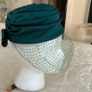 Vintage ladies hat as per union label . Vibrant green pleated satin with veil.